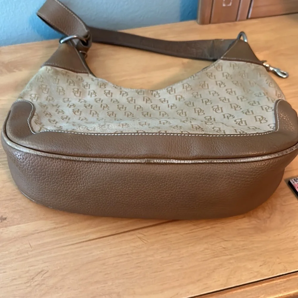 Dooney and Bourke classic monogram canvas and leather Tan color small hobo bag